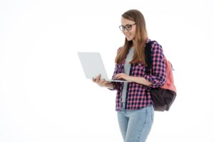 Leaving Cert Spanish Present My Teacher Dave girl holding laptop and smiling like she is enjoying her Spanish class